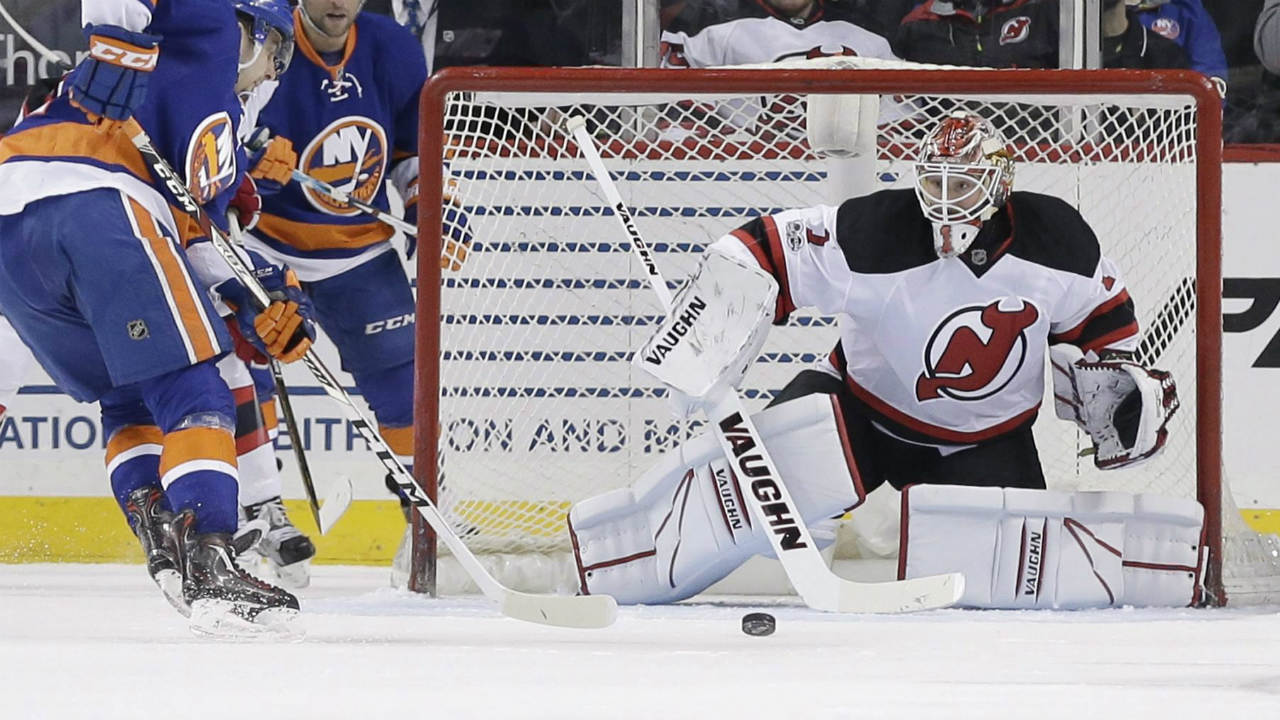 New-Jersey-Devils-goalie-Keith-Kinkaid-(1)-stops-a-shot-on-the-goal-by-New-York-Islanders'-Shane-Prince-(11)-during-the-first-period-of-an-NHL-hockey-game-Friday,-March-31,-2017,-in-New-York.-(Frank-Franklin-II/AP)