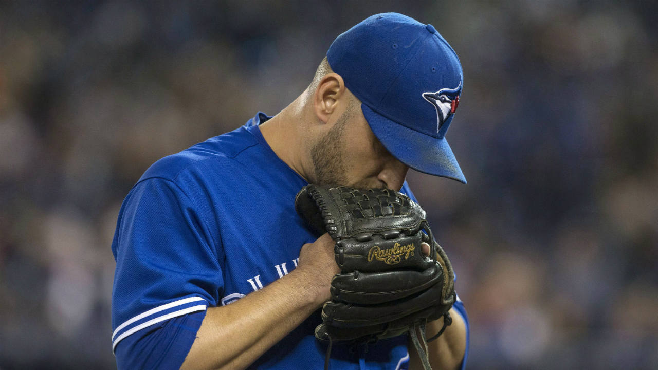 Toronto-Blue-Jays-starting-pitcher-Marco-Estrada-heads-to-the-dugout-at-the-end-of-the-first-inning-after-giving-up-a-home-run-in-his-first-pitch-against-the-Texas-Rangers-during-American-League-MLB-baseball-action-in-Toronto-on-Saturday,-May-27,-2017.-(Chris-Young/CP)