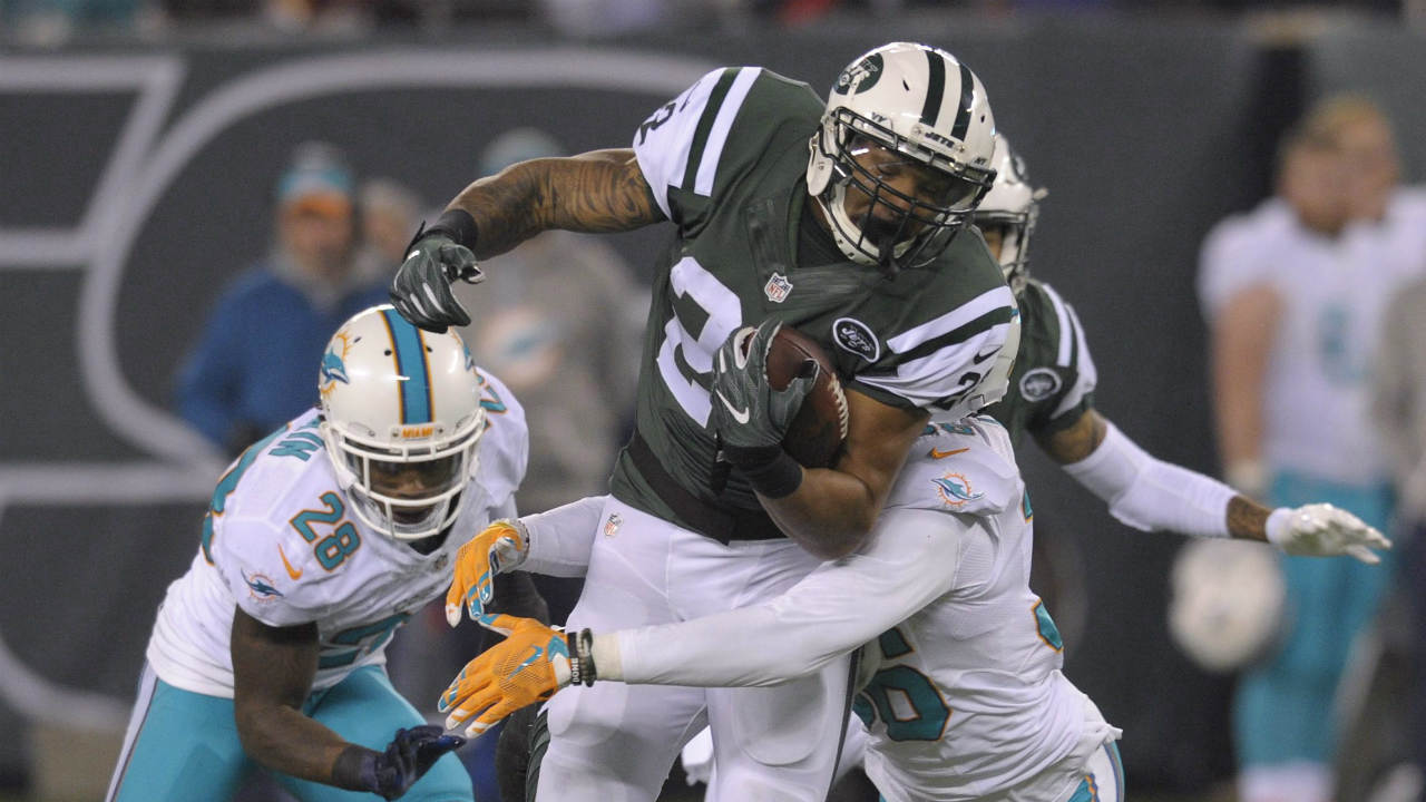 New-York-Jets-running-back-Matt-Forte-(22)-is-tackled-by-the-Miami-Dolphins-during-the-fourth-quarter-of-an-NFL-football-game,-Saturday,-Dec.-17,-2016,-in-East-Rutherford,-N.J.-(Bill-Kostroun/AP)