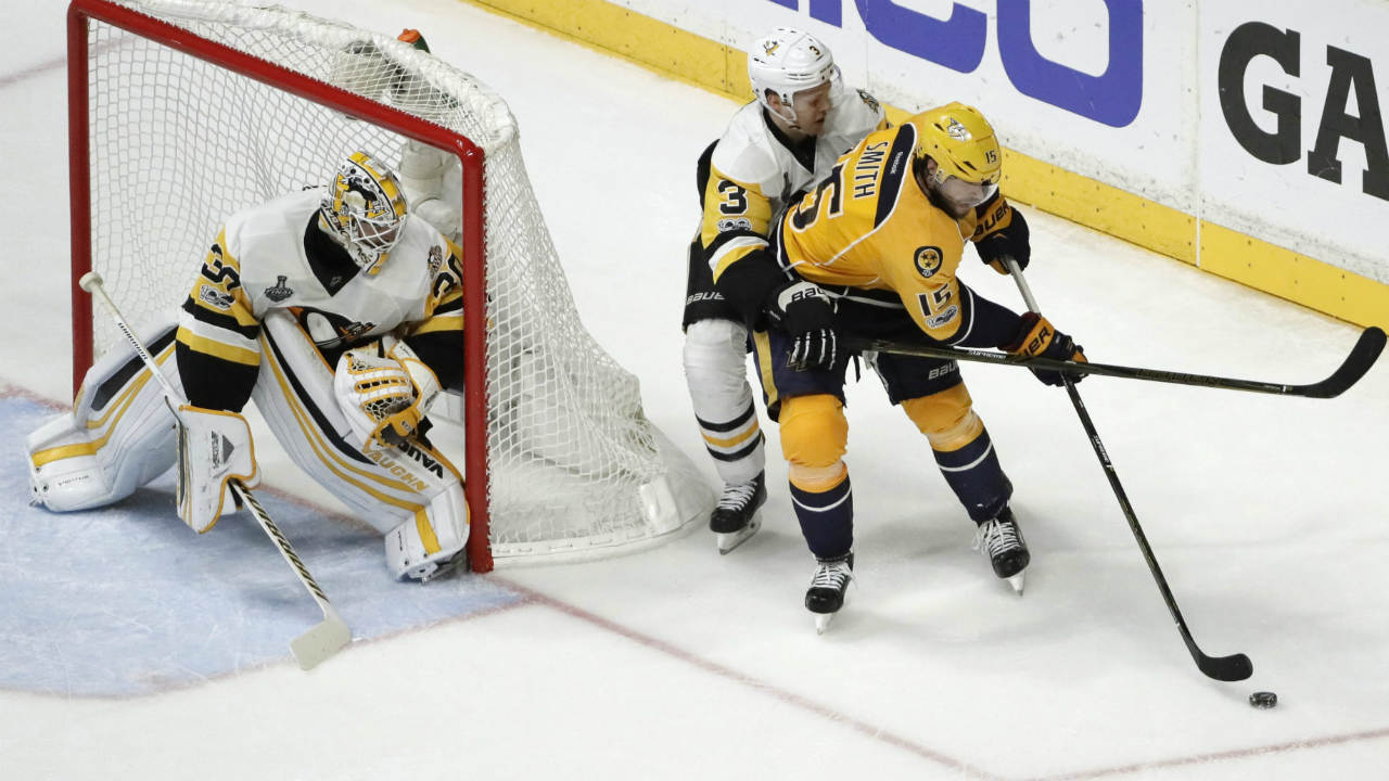 Nashville-Predators-right-wing-Craig-Smith-(15)-tries-to-drive-against-Pittsburgh-Penguins-defenseman-Olli-Maatta-(3),-of-Finland,-and-Matt-Murray-(30)-during-the-third-period-in-Game-4-of-the-NHL-hockey-Stanley-Cup-Finals-Monday,-June-5,-2017,-in-Nashville,-Tenn.-(Mark-Humphrey/AP)