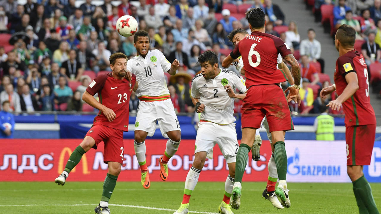 Mexico's-Hector-Moreno,-3rd-from-right,-scores-his-side's-second-goal-during-the-Confederations-Cup,-Group-A-soccer-match-between-Portugal-and-Mexico,-at-the-Kazan-Arena,-Russia,-Sunday,-June-18,-2017.-(Martin-Meissner/AP)