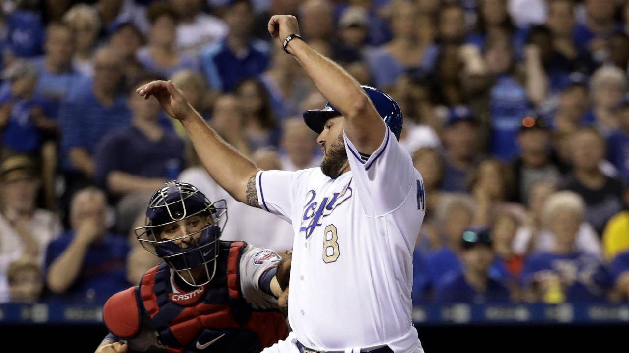 Kansas-City-Royals'-Mike-Moustakas-beats-the-tag-at-home-by-Minnesota-Twins-catcher-Jason-Castro-to-score-on-a-sacrifice-fly-by-Alex-Gordon-during-the-eighth-inning-of-a-baseball-game-Friday,-June-30,-2017,-in-Kansas-City,-Mo.-(Charlie-Riedel/AP)