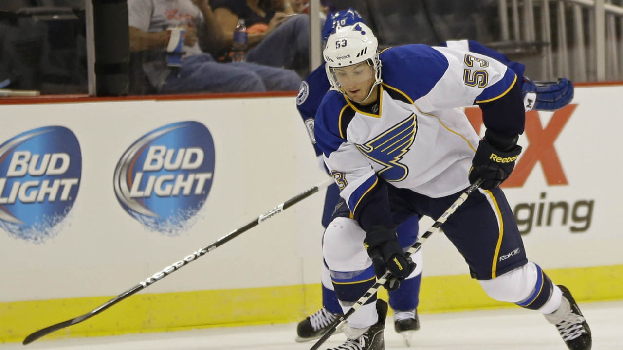 St.-Louis-Blues'-Pat-Cannone-(53)-moves-the-puck-in-front-of-Tampa-Bay-Lightning-left-wing-Mike-Angelidis-during-the-first-period-of-an-NHL-preseason-hockey-game-in-Orlando,-Fla.,-Wednesday,-Sept.-18,-2013.-(John-Raoux/AP)