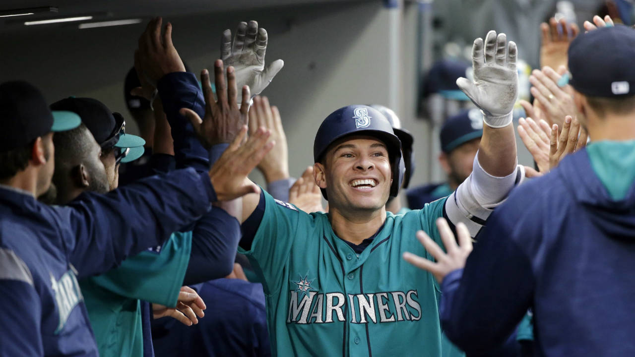 Seattle-Mariners'-Danny-Valencia-is-congratulated-by-teammates-on-his-three-run-home-run-against-the-Tampa-Bay-Rays-during-the-third-inning-of-a-baseball-game-Friday,-June-2,-2017,-in-Seattle.-(Elaine-Thompson/AP)