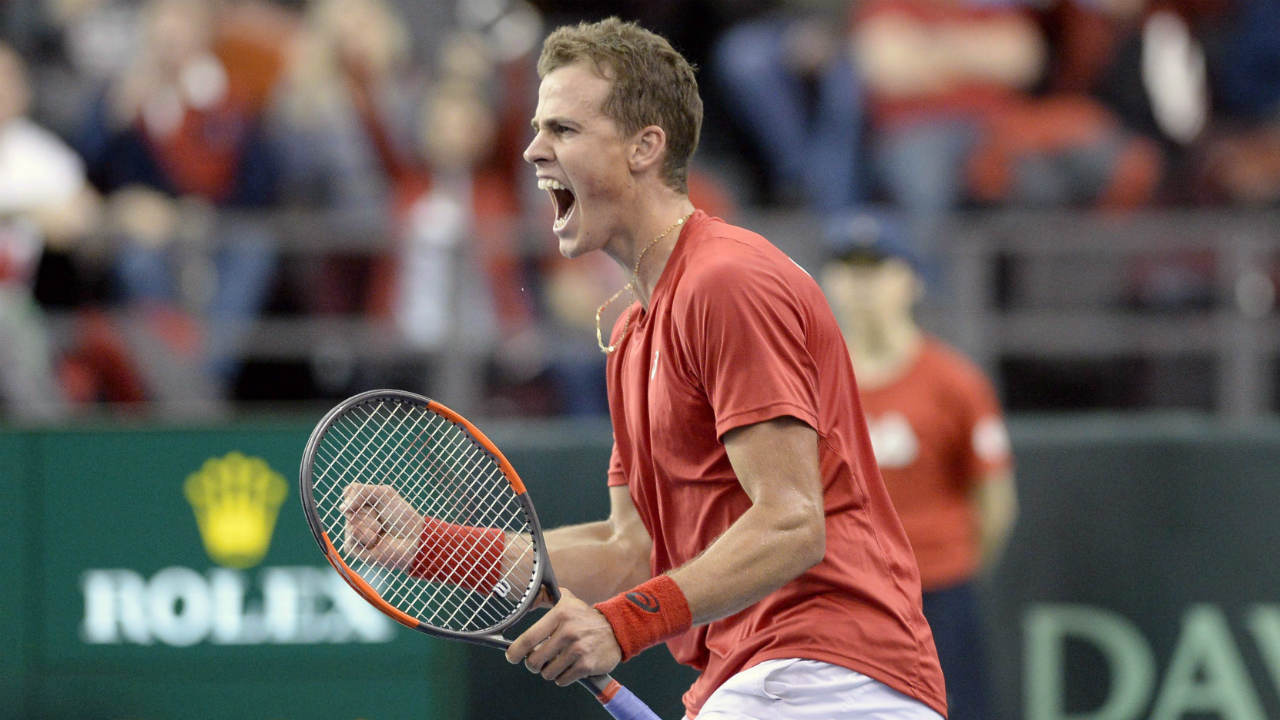 Canada's-Vasek-Pospisil-celebrates-after-defeating-Daniel-Evans-during-Davis-Cup-World-Group-tie-tennis-action,-Sunday,-Feb.-5,-2017-in-Ottawa.-(Justin-Tang/CP)