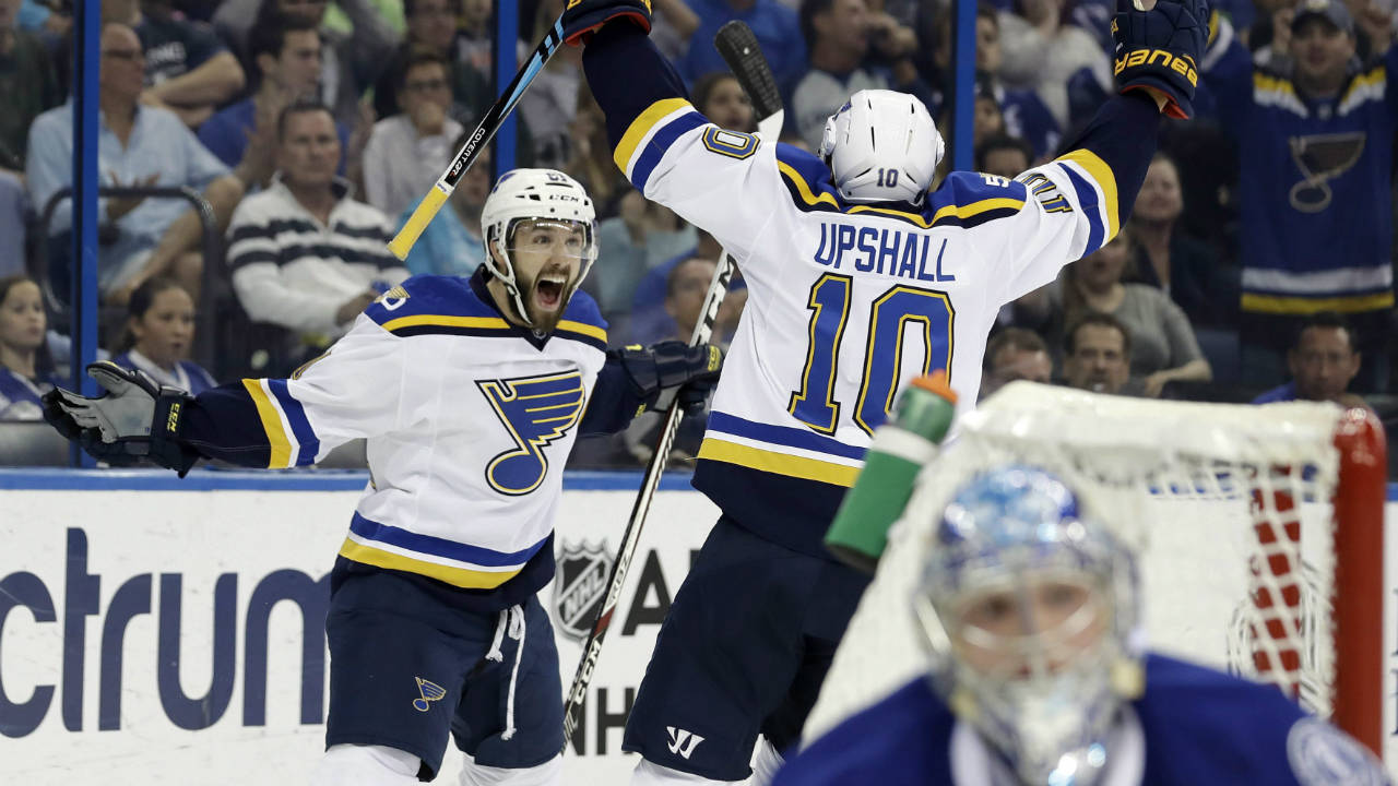 St.-Louis-Blues-centre-Wade-Megan-(61)-celebrates-with-teammate-right-wing-Scottie-Upshall-(10)-after-scoring-against-the-Tampa-Bay-Lightning-during-the-first-period-of-an-NHL-hockey-game-Thursday,-Dec.-22,-2016,-in-Tampa,-Fla.-(Chris-O'Meara/AP)