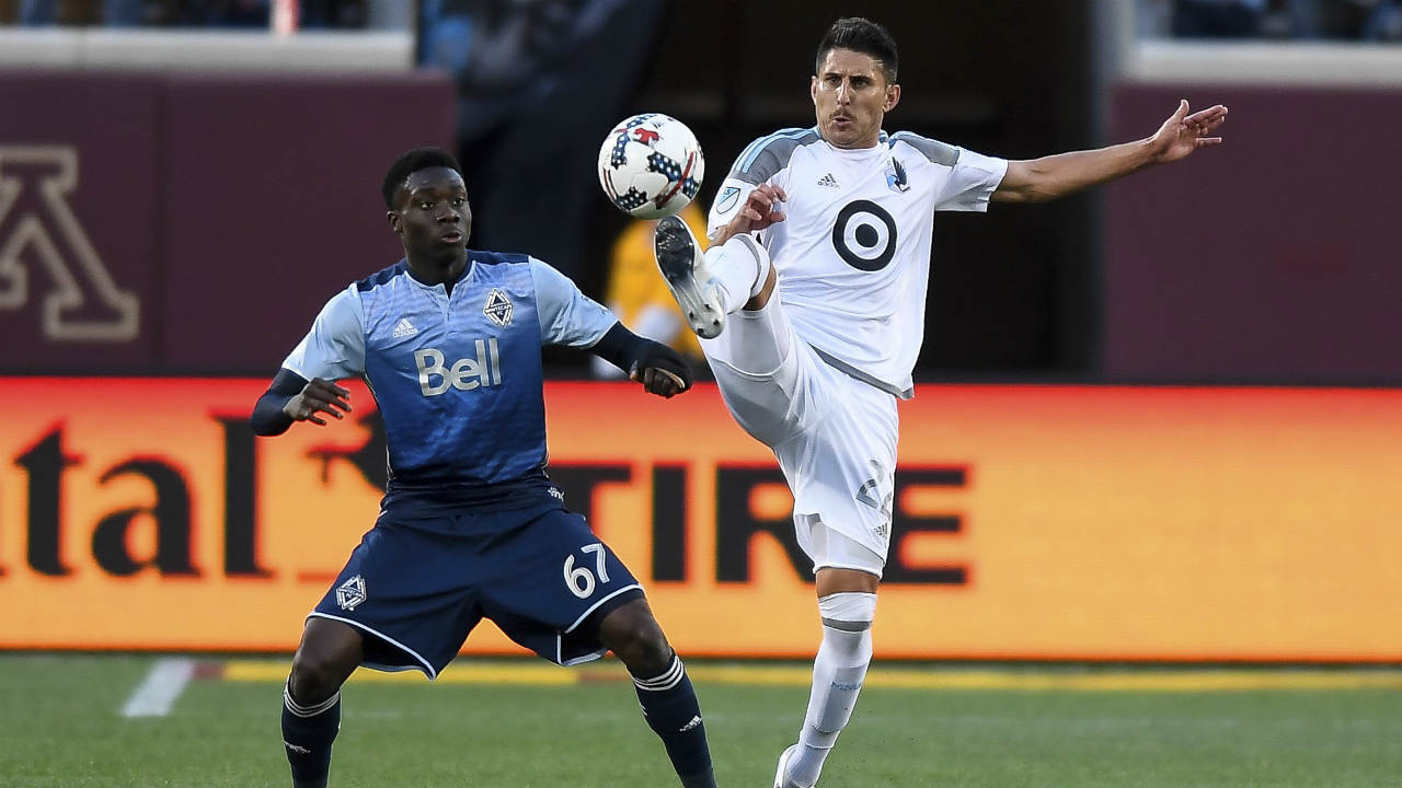 Minnesota-United-defender-Kevin-Venegas,-right,-and-Vancouver-Whitecaps-forward-Alphonso-Davies-(67)-compete-for-the-ball-during-the-second-half-of-an-MLS-soccer-match-Saturday,-June-24,-2017,-in-Minneapolis.-(Aaron-Lavinsky/Star-Tribune-via-AP)