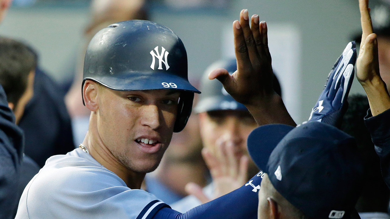 New-York-Yankees'-Aaron-Judge-is-greeted-in-the-dugout-after-he-hit-a-three-run-home-run.-(Ted-S.-Warren/AP)