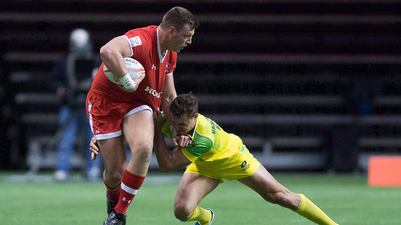 Canada's-Adam-Zaruba,-left,-fights-off-Australia's-Stephan-van-der-Walt.-(Darryl-Dyck/AP)