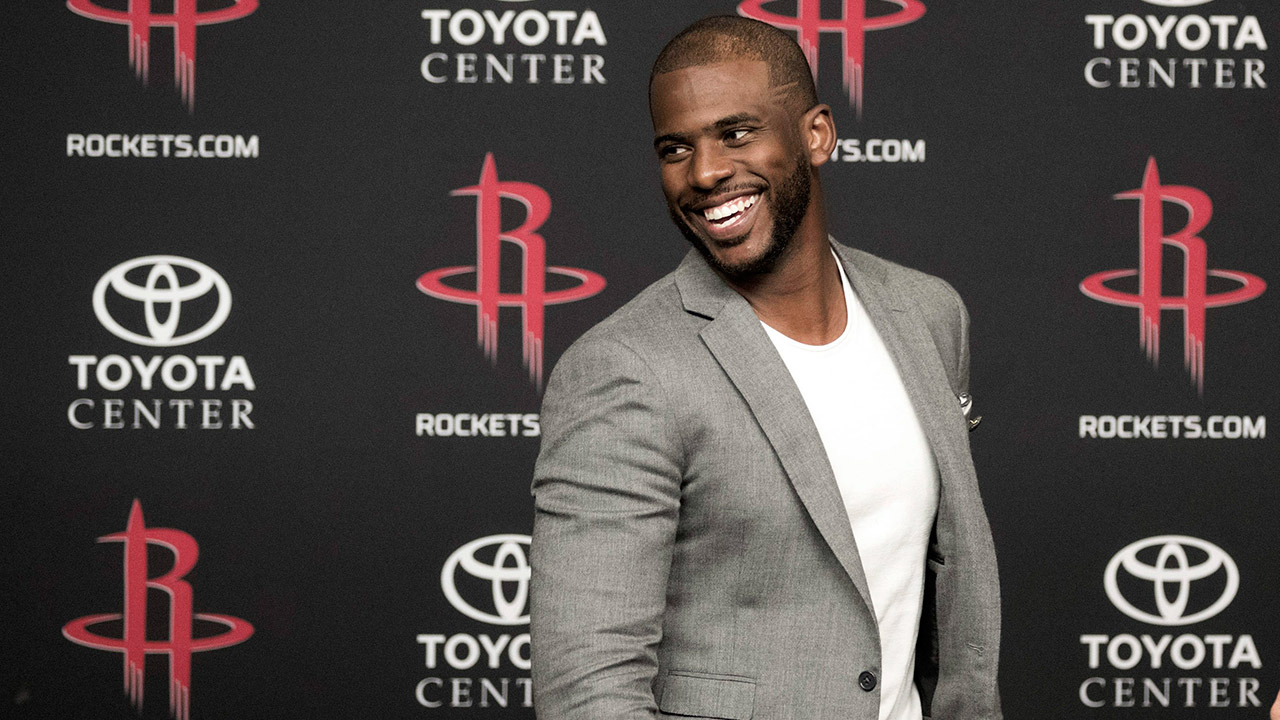 Chris-Paul-smiles-after-a-news-conference-to-introduce-him-as-the-newest-member-of-the-Houston-Rockets.-(David-J.-Phillip/AP)