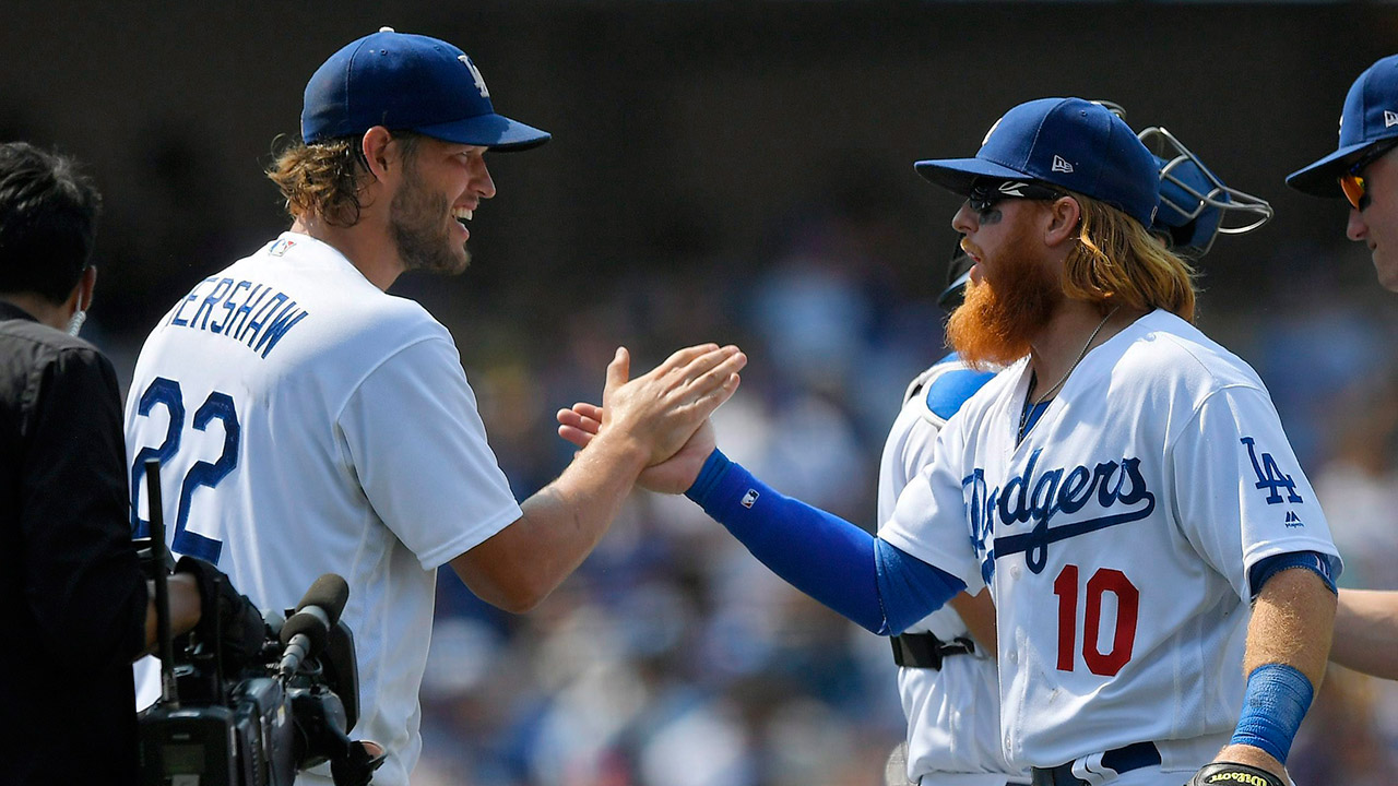 Los-Angeles-Dodgers-starting-pitcher-Clayton-Kershaw,-left,-and-third-baseman-Justin-Turner.-(Mark-J.-Terrill/AP)