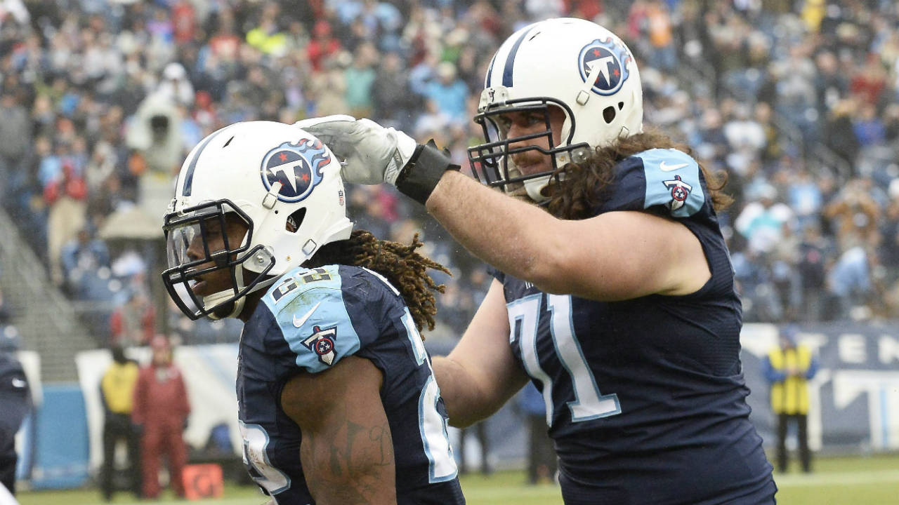 Tennessee-Titans-running-back-Derrick-Henry-(22)-is-congratulated-by-offensive-tackle-Dennis-Kelly-(71)-after-Henry-scored-a-touchdown-on-a-2-yard-run-against-the-Houston-Texans-in-the-second-half-of-an-NFL-football-game-Sunday,-Jan.-1,-2017,-in-Nashville,-Tenn.-(Mark-Zaleski/AP)