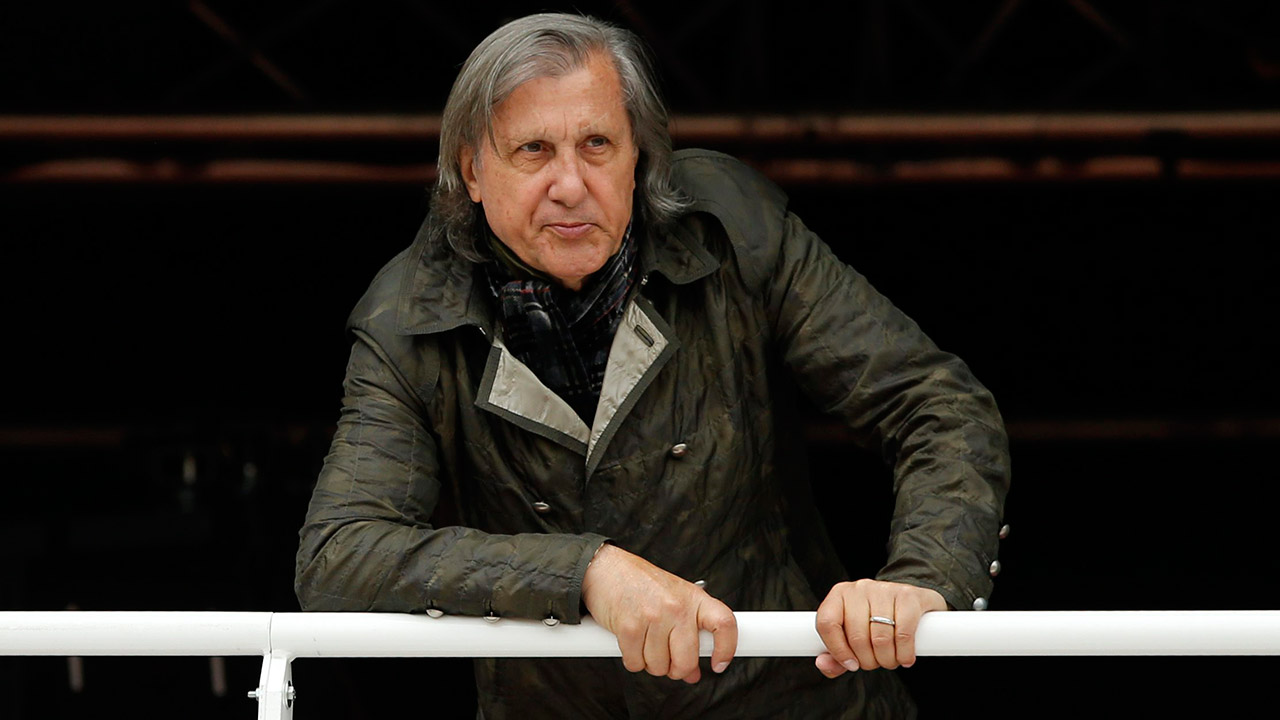 Former-Romanian-tennis-ace-Ilie-Nastase-watches-a-match-of-the-French-Open-tennis-tournament.-(Alastair-Grant/AP)