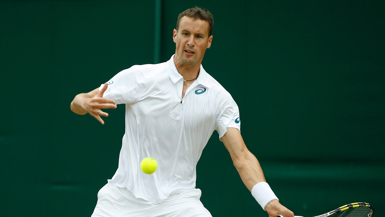 Kenny-De-Schepper-of-France-returns-a-shot-during-the-men's-singles-match-against-Richard-Gasquet.-(Alastair-Grant/AP)