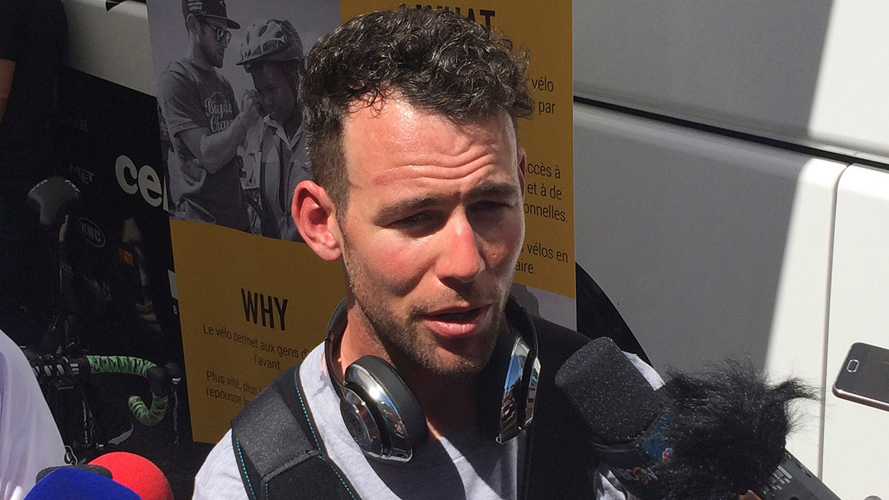 British-rider-Mark-Cavendish-speaks-to-reporters-after-pulling-out-of-the-race-with-broken-shoulder-prior-to-the-fifth-stage-of-the-Tour-de-France-cycling-race-over-160.5-kilometers-(99.7-miles)-with-start-in-Vittel-and-finish-in-La-Planche-des-Belles-Filles,-France,-Wednesday,-July-5,-2017.-Cavendish-sustained-the-injury-in-a-crash-Tuesday-for-which-Peter-Sagan-was-disqualified.-(John-Leicester/AP)