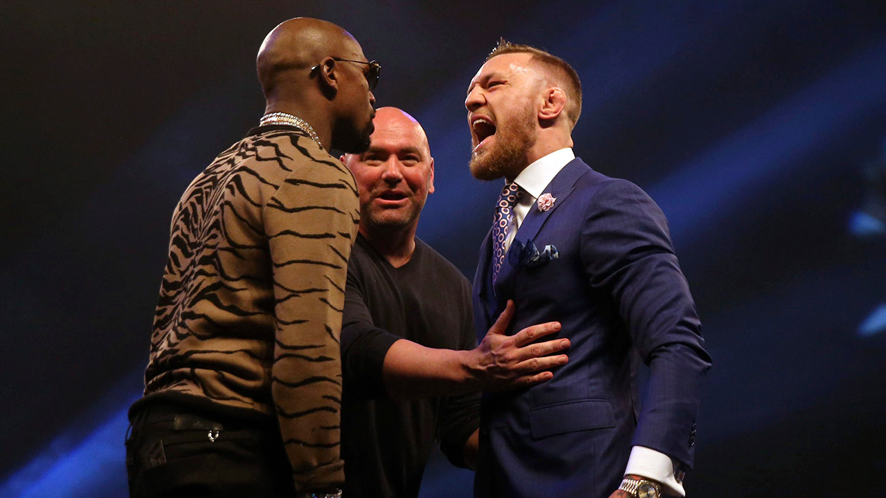 Boxers-Connor-McGregor,-right-and-Floyd-Mayweather.-(Scott-Heavey/AP)