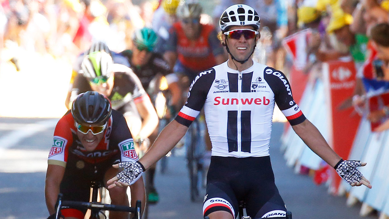 Australia's-Michael-Matthews-celebrates-as-he-crosses-the-finish-line-to-win-the-fourteenth-stage-of-the-Tour-de-France-.-(Christophe-Ena/AP)
