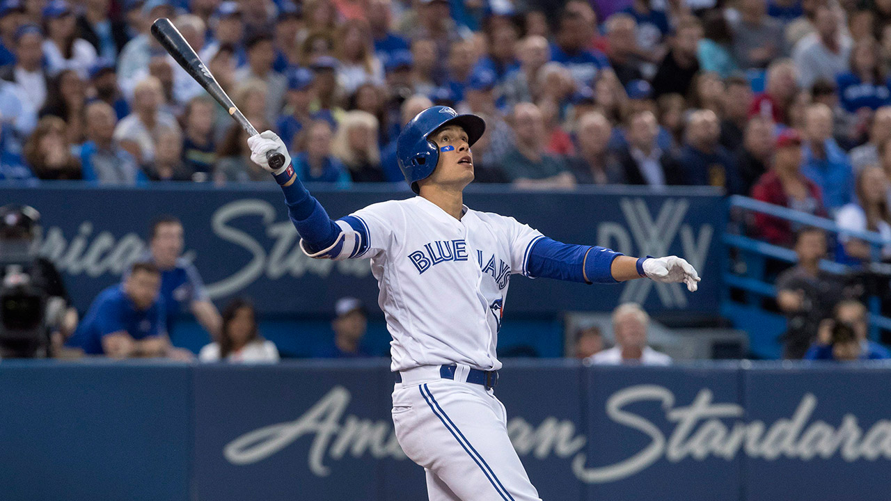 Toronto-Blue-Jays-Ryan-Goins-watches-pop-fly-drop-for-a-single.-(Fred-Thornhill/AP)