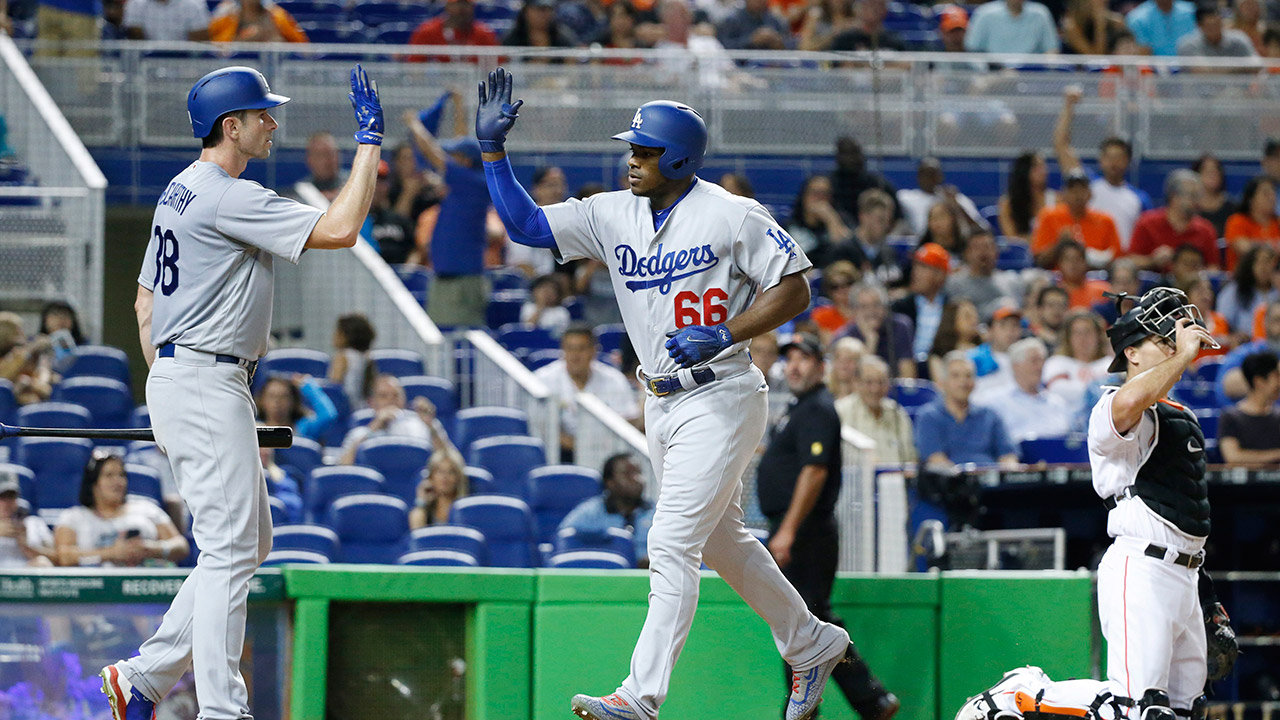 Los-Angeles-Dodgers'-Yasiel-Puig-(66)-is-congratulated-by-Brandon-McCarthy-after-Puig-hit-a-home-run.-(Wilfredo-Lee/AP)