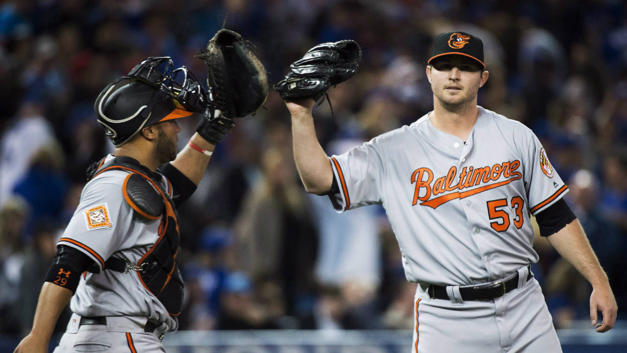 Baltimore-Orioles-closing-pitcher-Zach-Britton-(53)-celebrates-with-teammate-Welington-Castillo-(29)-after-defeating-the-Toronto-Blue-Jays-during-ninth-inning-AL-baseball-action-in-Toronto-on-Thursday,-April-13,-2017.-(Nathan-Denette/CP)
