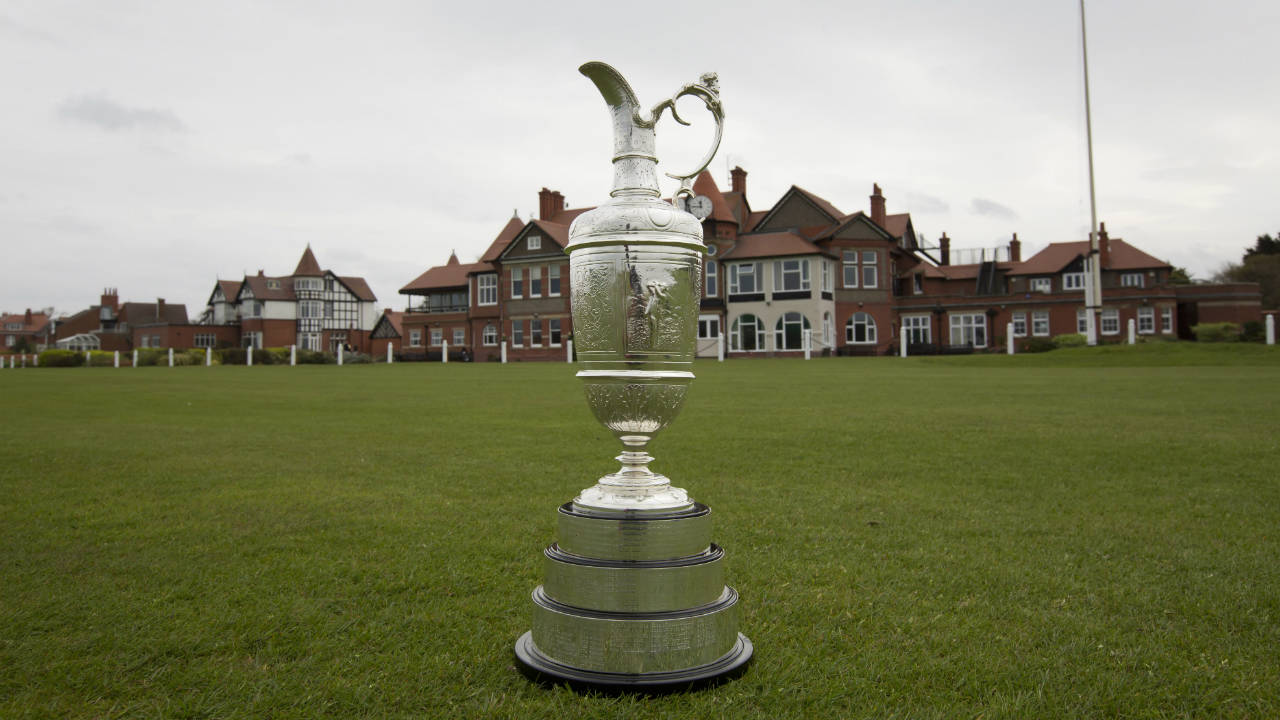 The-British-Open-Golf-trophy-the-"Claret-Jug"-is-displayed-by-the-clubhouse-at-the-Royal-Liverpool-Golf-Club-before-the-British-Open-golf-championships,-Hoylake,-England,-Wednesday,-April-23,-2014.-The-tournament-begins-on-Thursday-July-17,-2014.-(Jon-Super/AP)
