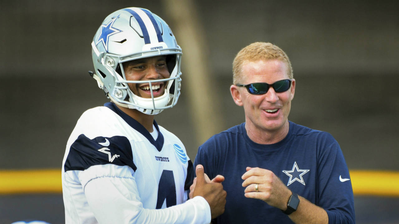 Dallas-Cowboys-quarterback-Dak-Prescott,-left,-and-head-coach-Jason-Garrett-have-fun-after-playing-catch-following-practice-at-the-NFL-football-team's-training-camp-in-Oxnard,-Calif.,-Monday,-July-24,-2017.-(Michael-Owen-Baker/AP)