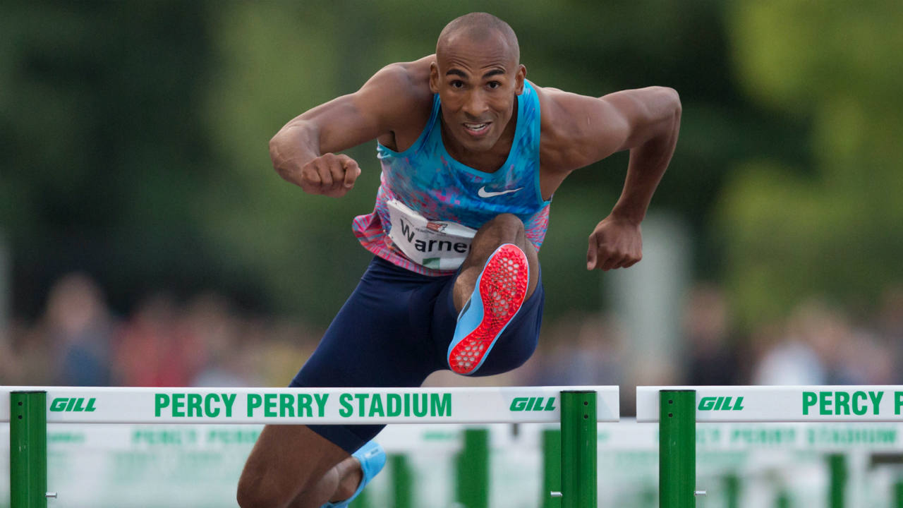 Canada's-Damian-Warner,-of-London,-Ont.,-races-to-a-first-place-finish-in-the-men's-110-metre-hurdles-at-the-Harry-Jerome-International-Track-Classic-in-Coquitlam,-B.C.,-on-Wednesday-June-28,-2017.-(Darryl-Dyck/CP)