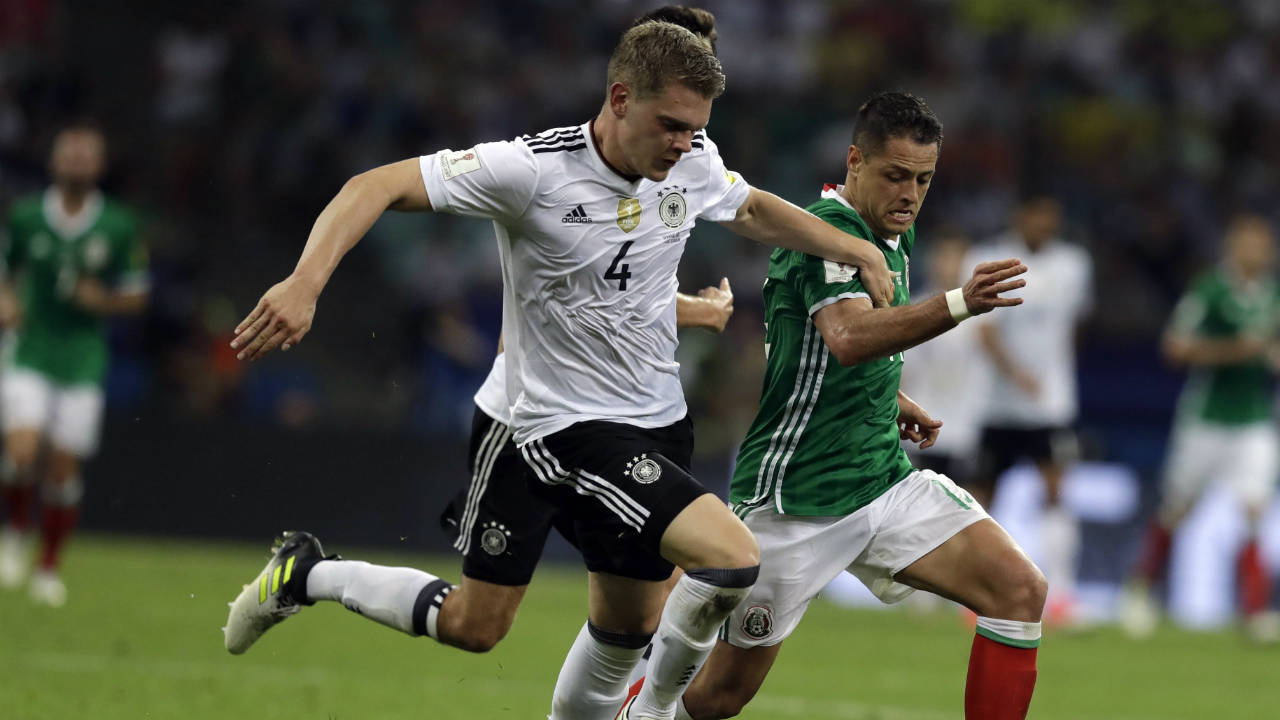 Mexico's-Javier-Hernandez,-right,-fights-for-the-ball-with-Germany's-Matthias-Ginter-during-the-Confederations-Cup,-semifinal-soccer-match-between-Germany-and-Mexico,-at-the-Fisht-Stadium-in-Sochi,-Russia,-Thursday,-June-29,-2017.-(Thanassis-Stavrakis/AP)