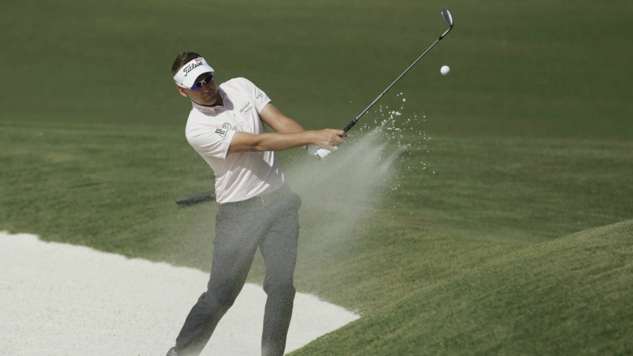 Ian-Poulter,-of-England,-hits-from-the-sand-on-the-11th-hole-during-the-final-round-of-The-Players-Championship-golf-tournament-Sunday,-May-14,-2017,-in-Ponte-Vedra-Beach,-Fla.-(Lynne-Sladky/AP)