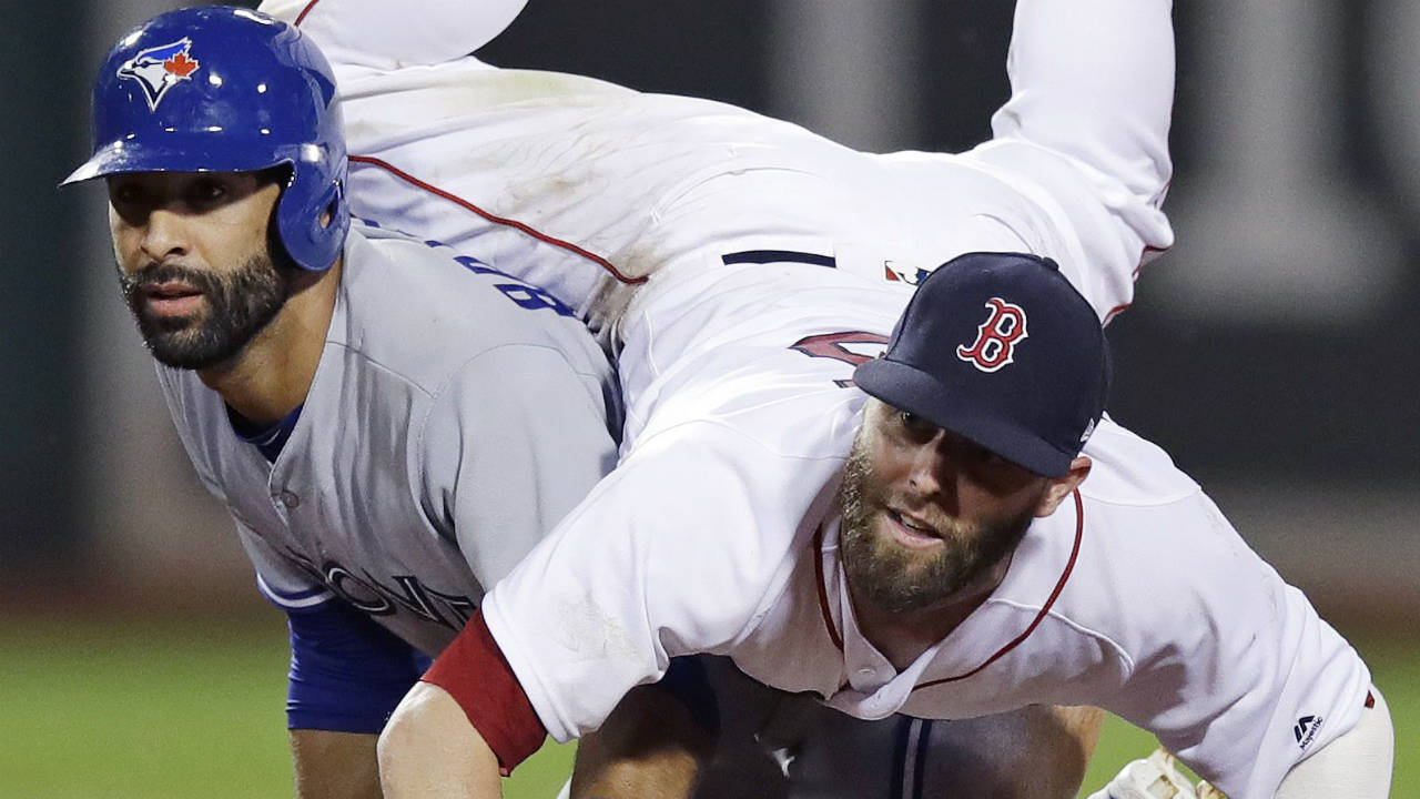 Boston-Red-Sox-second-baseman-Dustin-Pedroia-lands-on-Toronto-Blue-Jays'-Jose-Bautista-after-turning-a-double-play-during-the-11th-inning-of-a-baseball-game-at-Fenway-Park-in-Boston,-Tuesday,-July-18,-2017.-Russell-Martin-was-out-at-first.-(Charles-Krupa/AP)