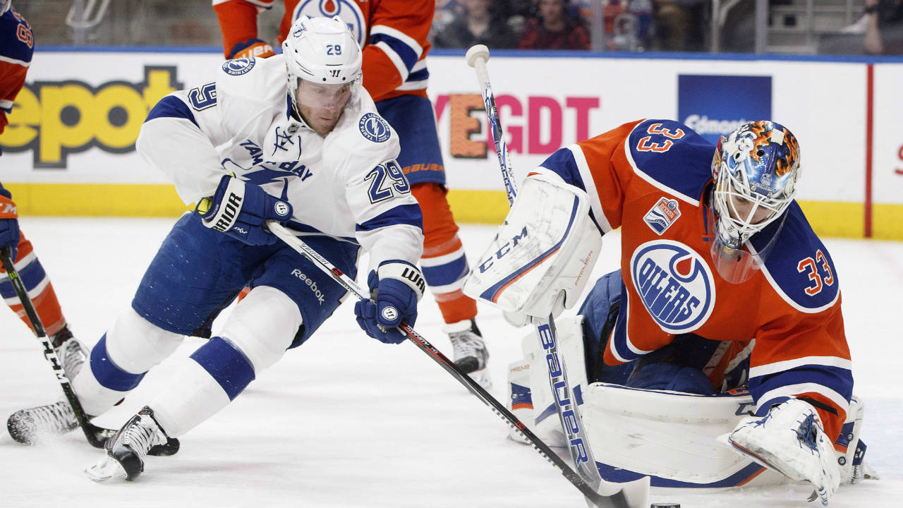 Tampa-Bay-Lightning's-Slater-Koekkoek-(29)-is-stopped-by-Edmonton-Oilers-goalie-Cam-Talbot-(33)-during-first-period-NHL-action-in-Edmonton,-Alta.,-on-Saturday-December-17,-2016.-(Jason-Franson/CP)