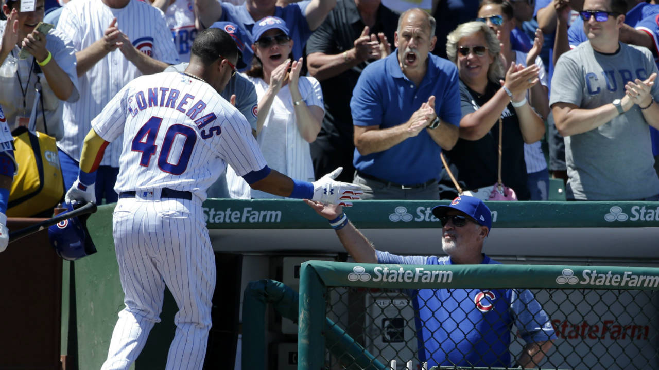 Chicago-Cubs'-Willson-Contreras,-left,-celebrates-his-three-run-home-run-off-Chicago-White-Sox-starting-pitcher-Carlos-Rodon-with-manager-Joe-Maddon-during-the-first-inning-of-a-baseball-game-Tuesday,-July-25,-2017,-in-Chicago.-Ben-Zobrist-and-Anthony-Rizzo-also-scored-on-the-play.-(Charles-Rex-Arbogast/AP)