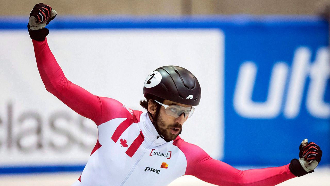 Charles-Hamelin-of-Canada-celebrates-during-the-men's-1,500-meters-final-race.-(Jens-Meyer/AP)