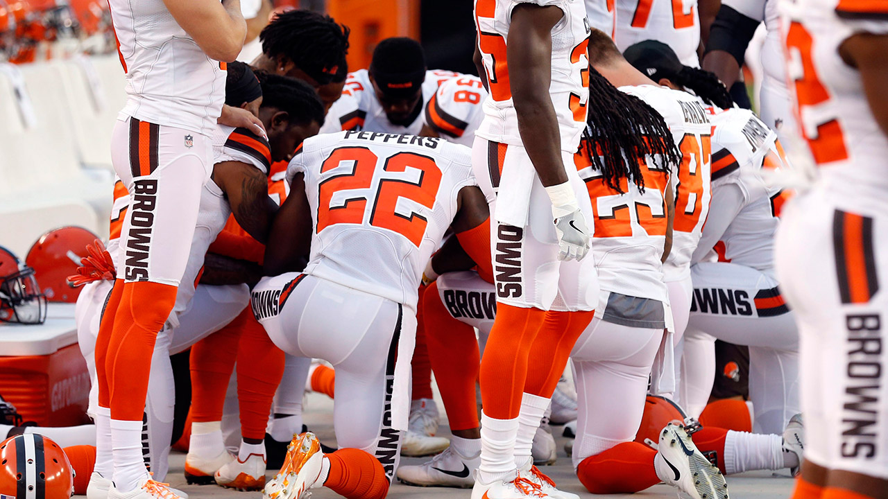 Members-of-the-Cleveland-Browns-kneel-during-the-national-anthem/-(Ron-Schwane/AP)