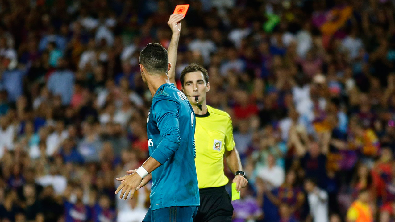 Referee-Ricardo-de-Burgos,-right,-shows-a-red-card-to-Real-Madrid's-Cristiano-Ronaldo.-(Manu-Fernandez/AP)