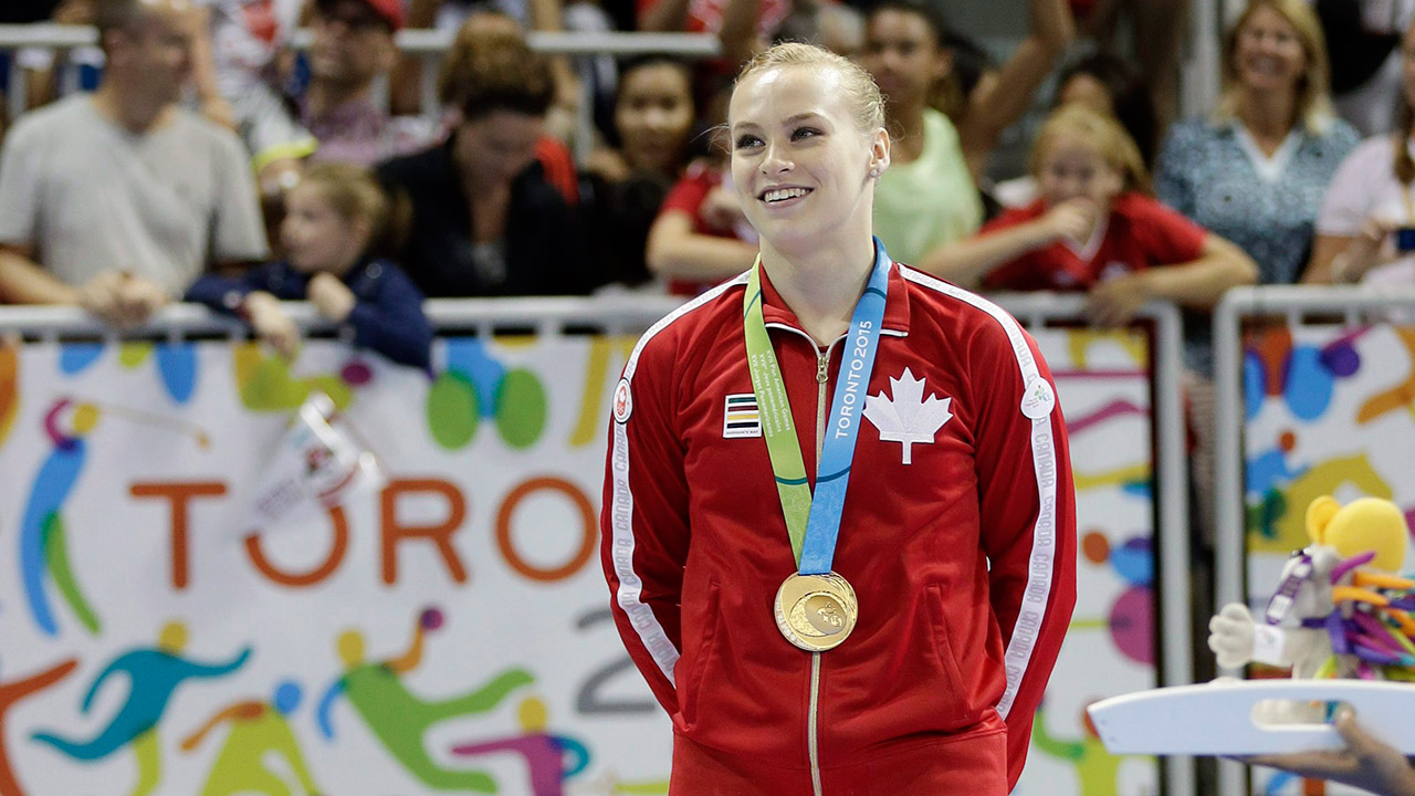 Canada's-Ellie-Black-poses-wearing-her-gold-medal.-(Gregory-Bull/AP)