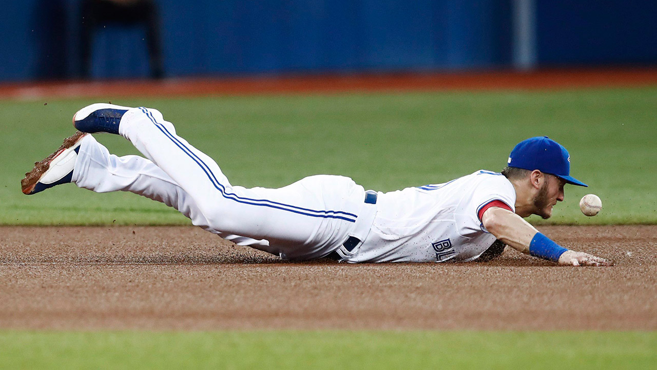 Toronto-Blue-Jays'-Josh-Donaldson-dives-after-a-ball-against-the-New-York-Yankees.-(Mark-Blinch/AP)