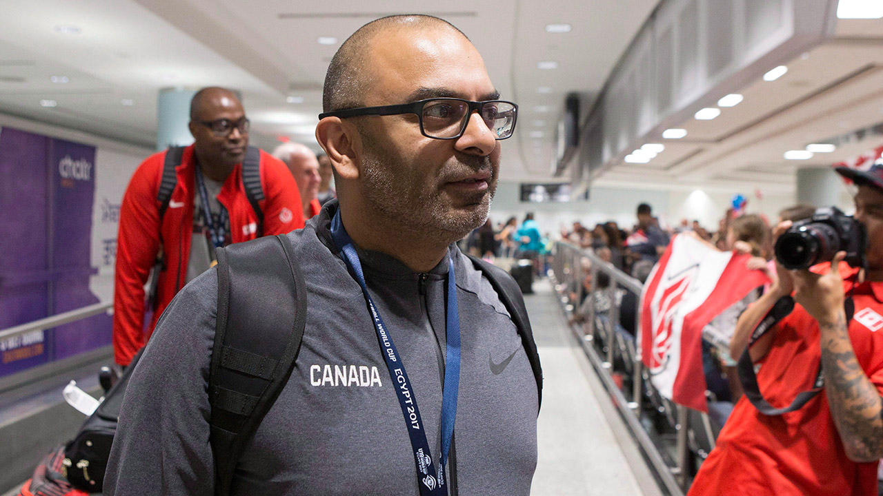 Head-Coach-Roy-Rana-arrives-at-Toronto's-Pearson-Airport.-(Chris-Young/AP)