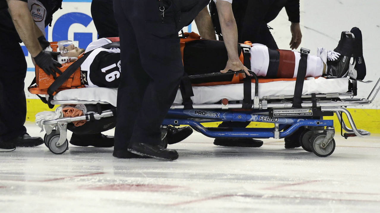 Arizona-Coyotes-centre-Alexander-Burmistrov-(91)-is-taken-off-the-ice-on-a-stretcher-following-a-hit-by-Boston-Bruins-defenceman-Colin-Miller-during-the-second-period-of-an-NHL-hockey-game-in-Boston,-Tuesday,-Feb.-28,-2017.-(Charles-Krupa/AP)