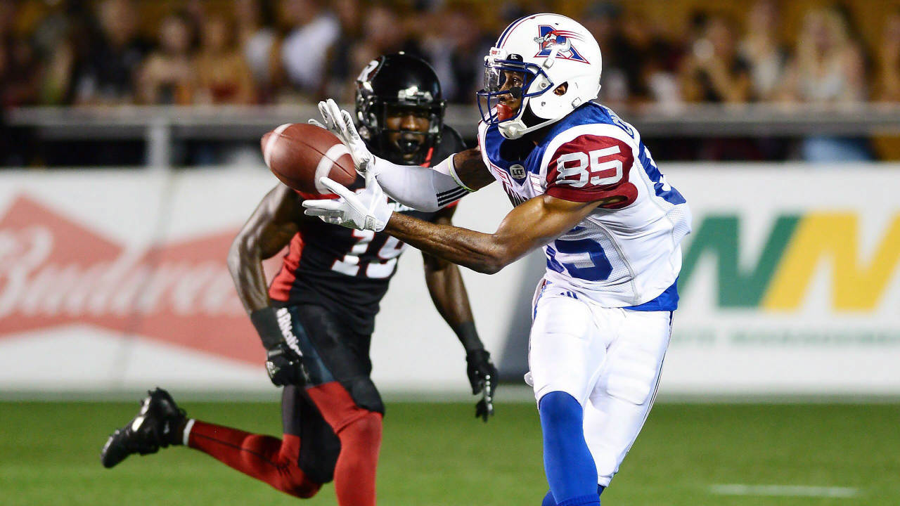 Montreal-Alouettes-wide-receiver-B.J.-Cunningham-(85)-makes-a-catch-in-front-of-Ottawa-Redblacks-defensive-back-Imoan-Claiborne-(19)-during-second-half-CFL-football-action-in-Ottawa-on-Wednesday,-July-19,-2017.-(Sean-Kilpatrick/CP)