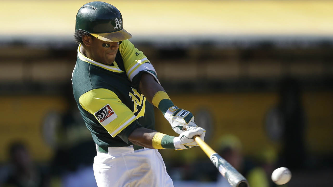 Oakland-Athletics'-Khris-Davis-connects-for-an-RBI-single-off-Texas-Rangers'-Ricky-Rodriguez-in-the-eighth-inning-of-a-baseball-game-Sunday,-Aug.-27,-2017,-in-Oakland,-Calif.-(Ben-Margot/AP)