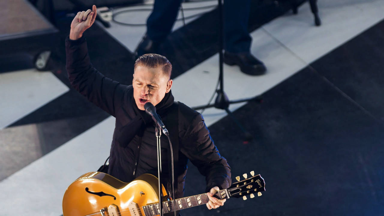 Canadian-singer-Bryan-Adams-performs-during-the-first-intermission-at-the-NHL-Centennial-Classic-hockey-game-between-the-Detroit-Red-Wings-and-the-Toronto-Maple-Leafs-in-Toronto-on-Sunday,-January-1,-2017.-(Nathan-Denette/CP)