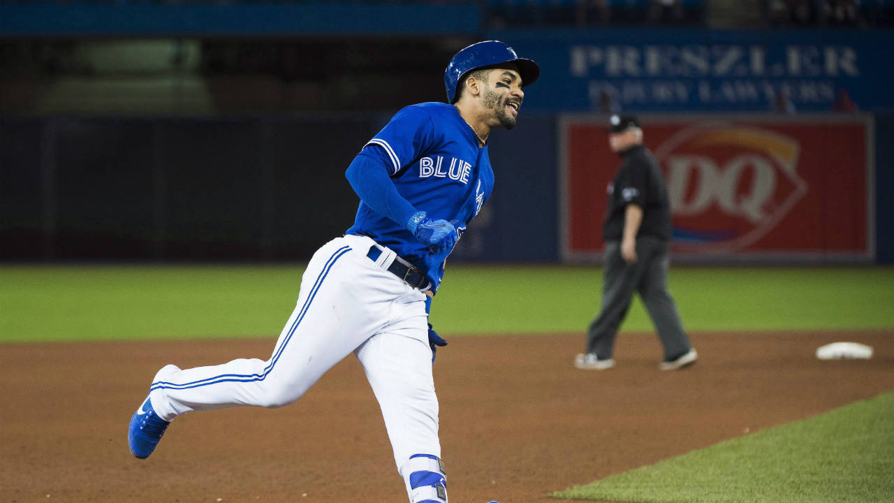 Toronto-Blue-Jays-second-baseman-Devon-Travis-(29)-smiles-as-he-rounds-the-bases-after-hitting-a-two-run-homer-during-seventh-inning-interleague-baseball-action-in-Toronto-on-Wednesday,-May-31,-2017.-(Nathan-Denette/CP)