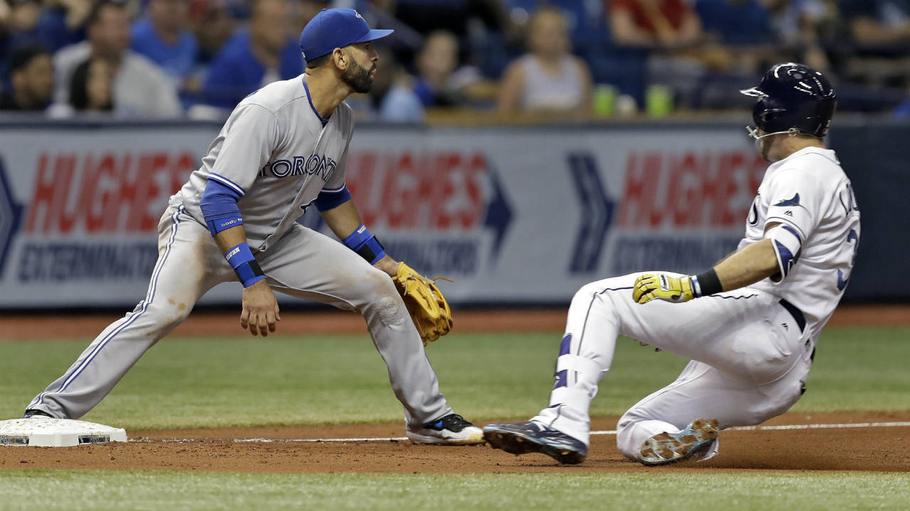 Tampa-Bay-Rays'-Evan-Longoria,-right,-slides-into-third-base-ahead-of-the-throw-to-Toronto-Blue-Jays-third-baseman-Jose-Bautista-during-the-fifth-inning-of-a-baseball-game-Tuesday,-Aug.-22,-2017,-in-St.-Petersburg,-Fla.-longoria-was-credited-with-a-double-and-took-third-on-an-error-by-Blue-Jays-centre-fielder-Ezequiel-Carrera.-(Chris-O'Meara/AP)
