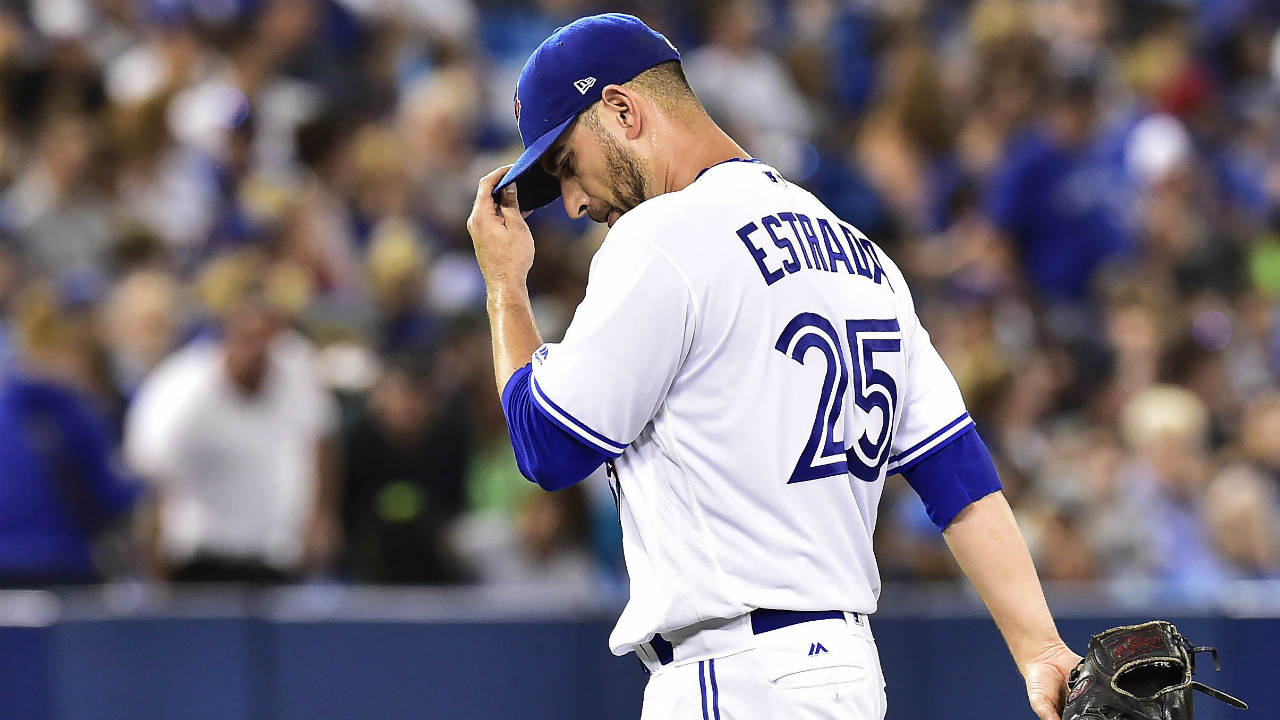 Toronto-Blue-Jays-starting-pitcher-Marco-Estrada-(25)-walks-back-to-the-dugout-after-being-taken-out-of-the-game-during-fifth-inning-American-league-baseball-action-against-the-Tampa-Bay-Rays-in-Toronto-on-Tuesday,-August-15,-2017.-(Frank-Gunn/CP)