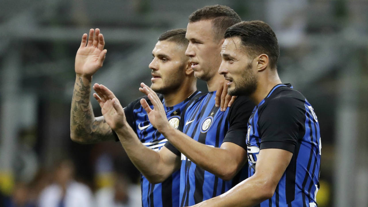 Inter-Milan's-Ivan-Perisic,-centre,-celebrates-with-his-teammates-Mauro-Icardi,-left,-and-Danilo-D'Ambrosio-after-scoring-during-the-Serie-A-soccer-match-between-Inter-Milan-and-Fiorentina-at-the-San-Siro-stadium-in-Milan,-Italy,-Sunday,-Aug.-20,-2017.-(Antonio-Calanni/AP)
