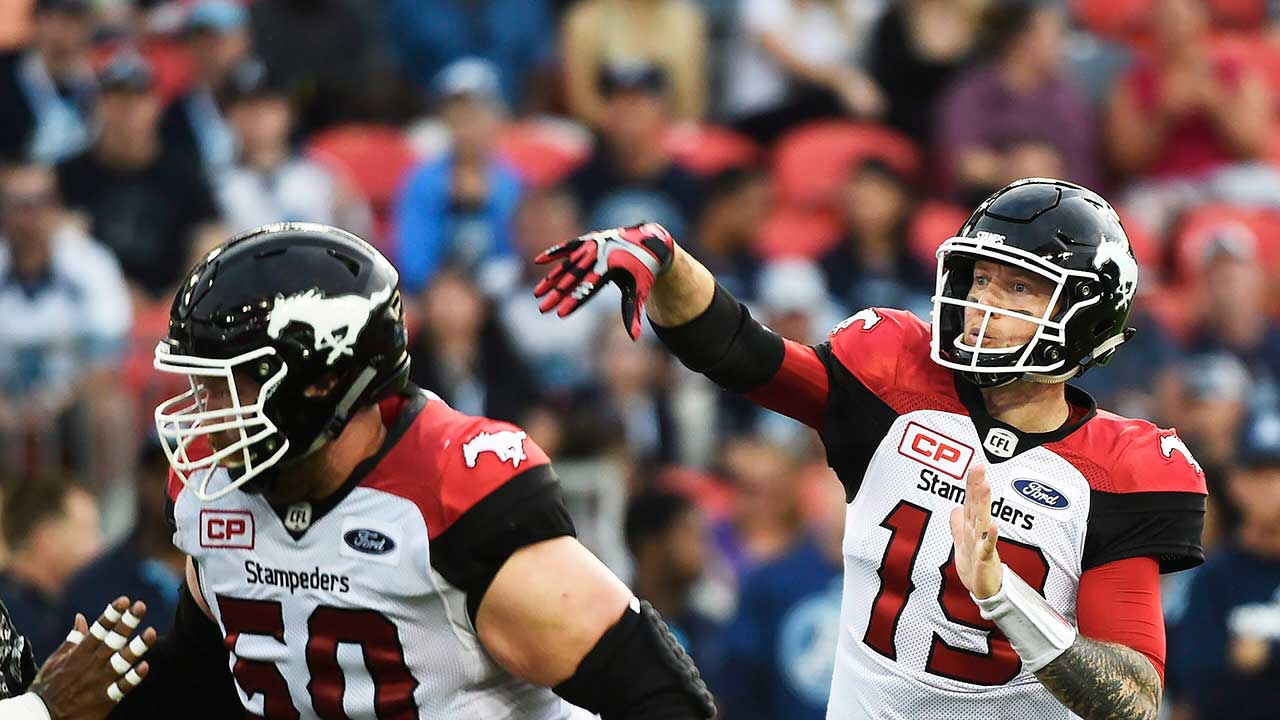 Calgary-Stampeders-quarterback-Bo-Levi-Mitchell-(19)-passes-against-the-Toronto-Argonauts.-(Nathan-Denette/CP)