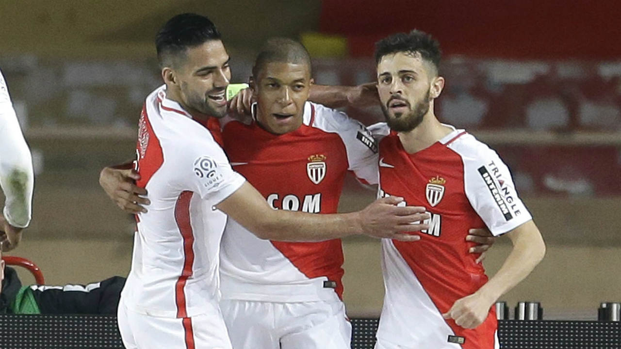 Monaco's-Bernardo-Silva,-right,-celebrates-with-teammates-Kylian-MBappe,-center-and-Radamel-Falcao,-after-scoring-during-a-League-One-soccer-match-between-Monaco-and-Lille,-at-the-Louis-II-stadium,-in-Monaco,-Sunday,-May,-14-2017.-(Claude-Paris/AP)