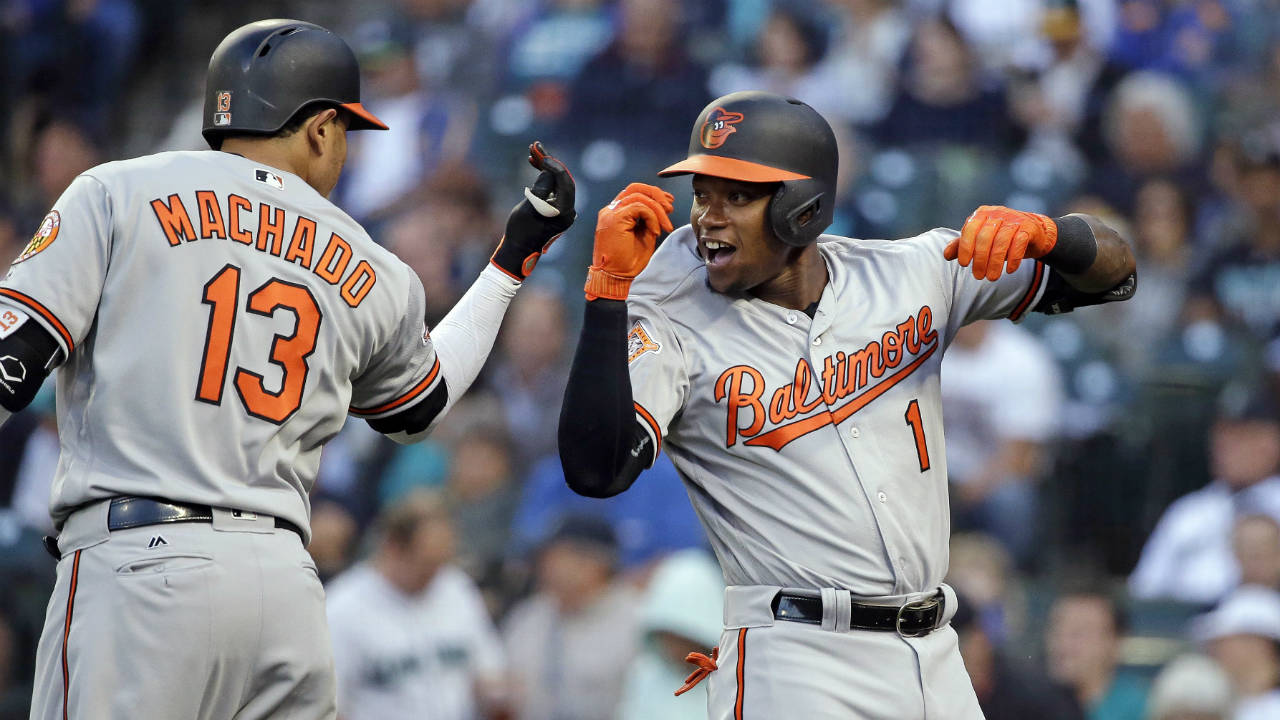Baltimore-Orioles'-Tim-Beckham-(1)-is-congratulated-by-Manny-Machado-on-his-home-run-against-the-Seattle-Mariners-on-the-first-pitch-of-the-first-inning-of-a-baseball-game,-Monday,-Aug.-14,-2017,-in-Seattle.-(Elaine-Thompson/AP)