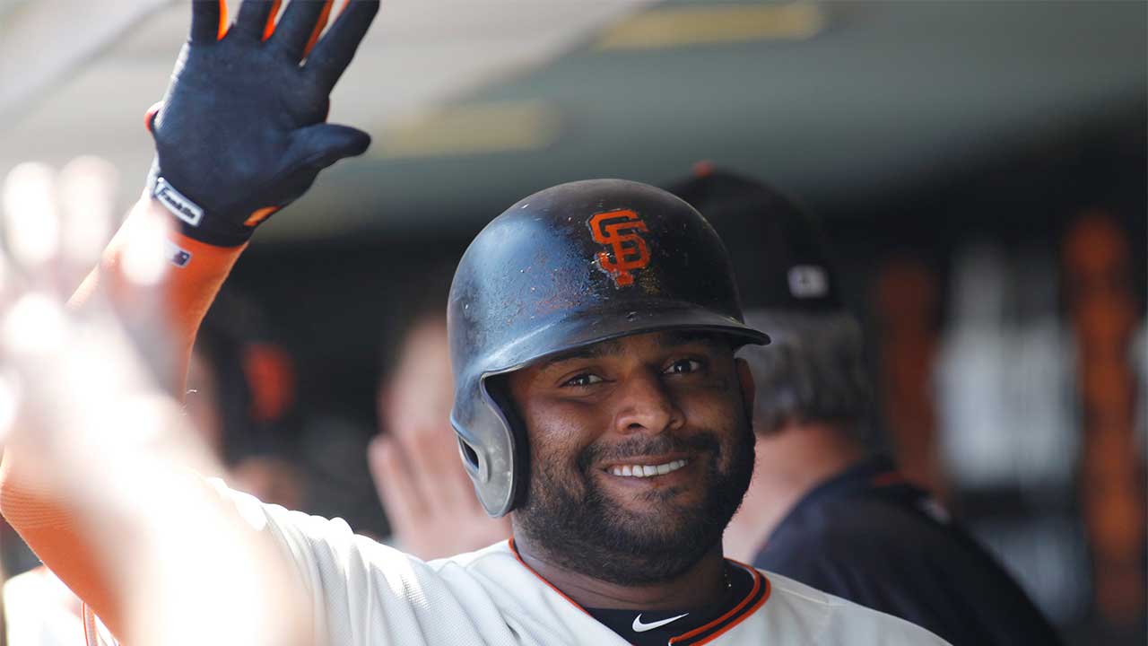 San Francisco Giants' Pablo Sandoval is greeted in the dugout after hitting a sacrifice fly to score Austin Slater during the fourth inning of a baseball game against the Arizona Diamondbacks, Sunday, Sept. 17, 2017. (George Nikitin/AP)